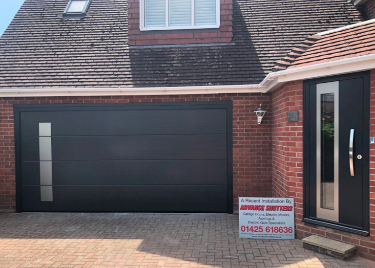 A black sectional garage door and new front door to match.