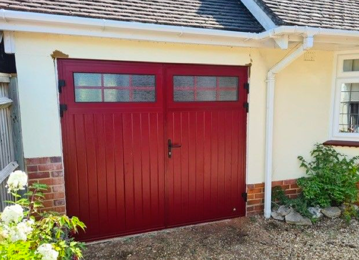 A red side-hinged garage door.