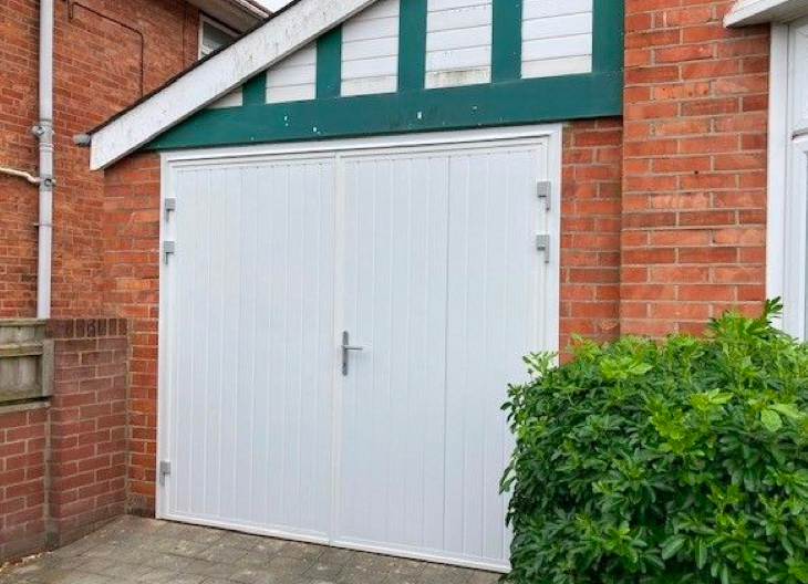 A white side-hinged garage door.