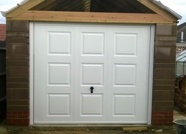 A white up and over garage door.