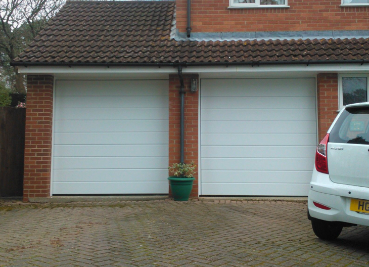 Two white up and over garage doors.
