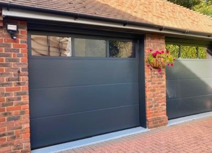 Two new up and over garage doors fitted to a property in Lymington.