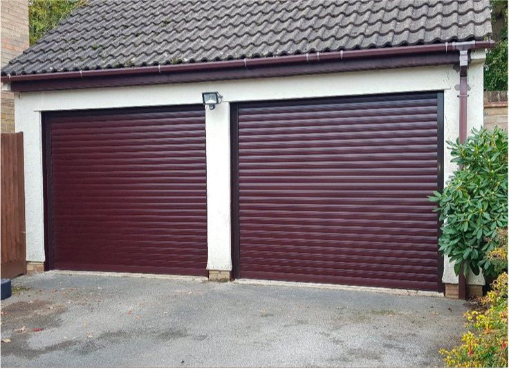 Two purple roller garage doors.
