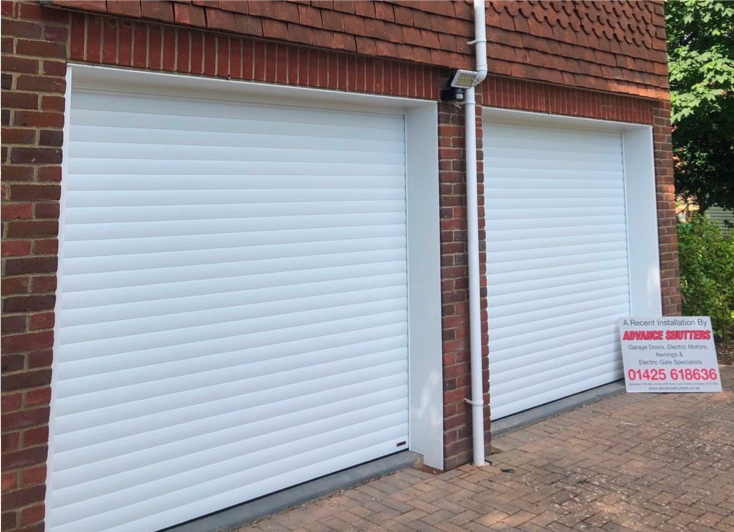 Two new white sectional garage doors.