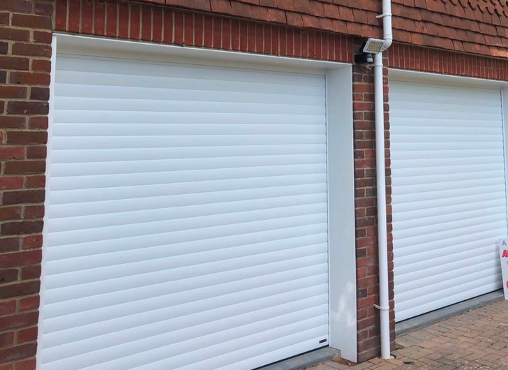 Two white sectional garage doors.