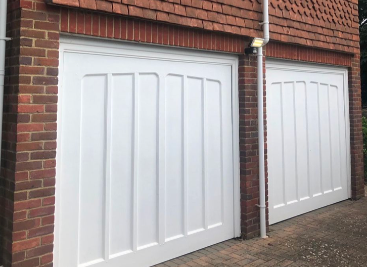 Two white up and over garage doors.
