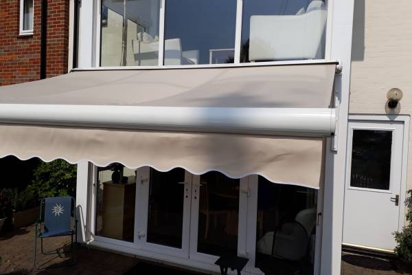 An awning, extended over a patio.