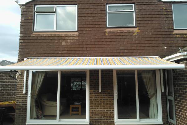 Front facing image of an awning on the back of a house.